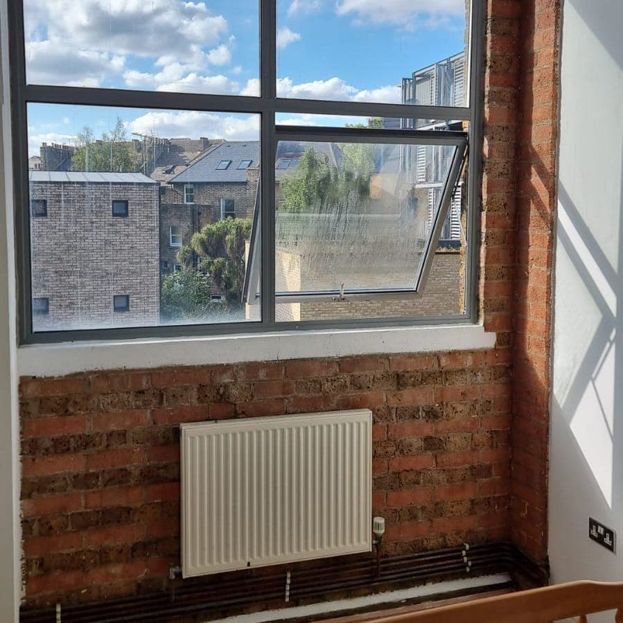 Brick feature wall in a second room clean, after treatment